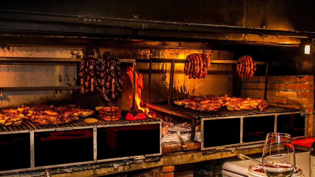 Image: A mouthwatering sight of culinary delights in Mendoza, showcasing a sizzling grill with a variety of succulent meats. Experience the authentic flavors and culinary excellence of Mendoza's renowned parrillas. Indulge in the tantalizing aroma and taste the culinary essence of this vibrant destination.